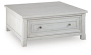 Ashley Furniture Robbinsdale lift-top coffee table with angled closed lid, showing its stylish wooden finish and functional design.