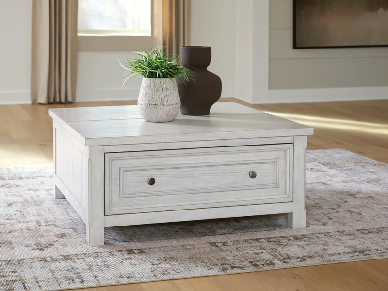 Ashley Furniture Robbinsdale lift-top cocktail coffee table with a closed top, showcasing its stylish wooden design and storage features.