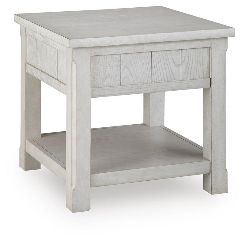 Ashley Furniture Robbinsdale End Table with wood finish, featuring a sleek tabletop and storage drawer.