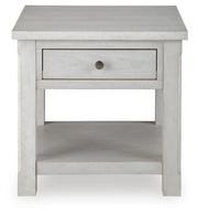 Ashley Furniture Robbinsdale End Table featuring a wooden top and tapered legs, shown from a head-on angle.