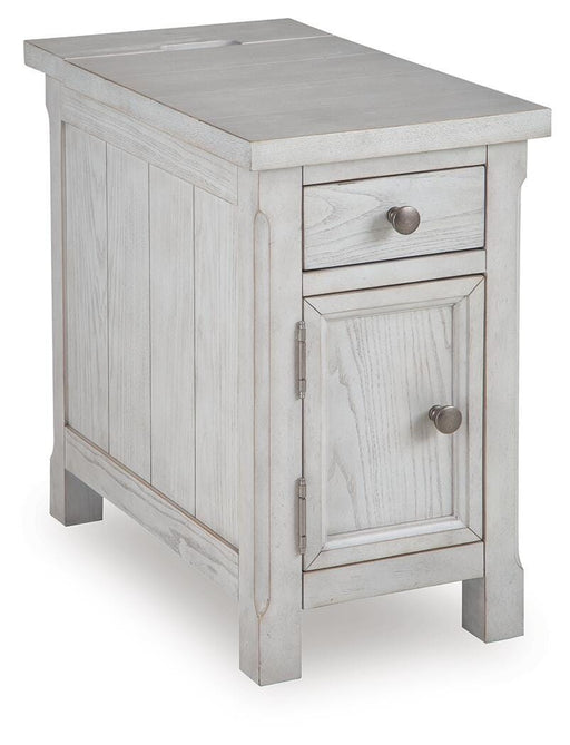 Ashley Furniture Robbinsdale chairside end table with a dark wood finish, angled design, and storage drawer, shown from an angle.