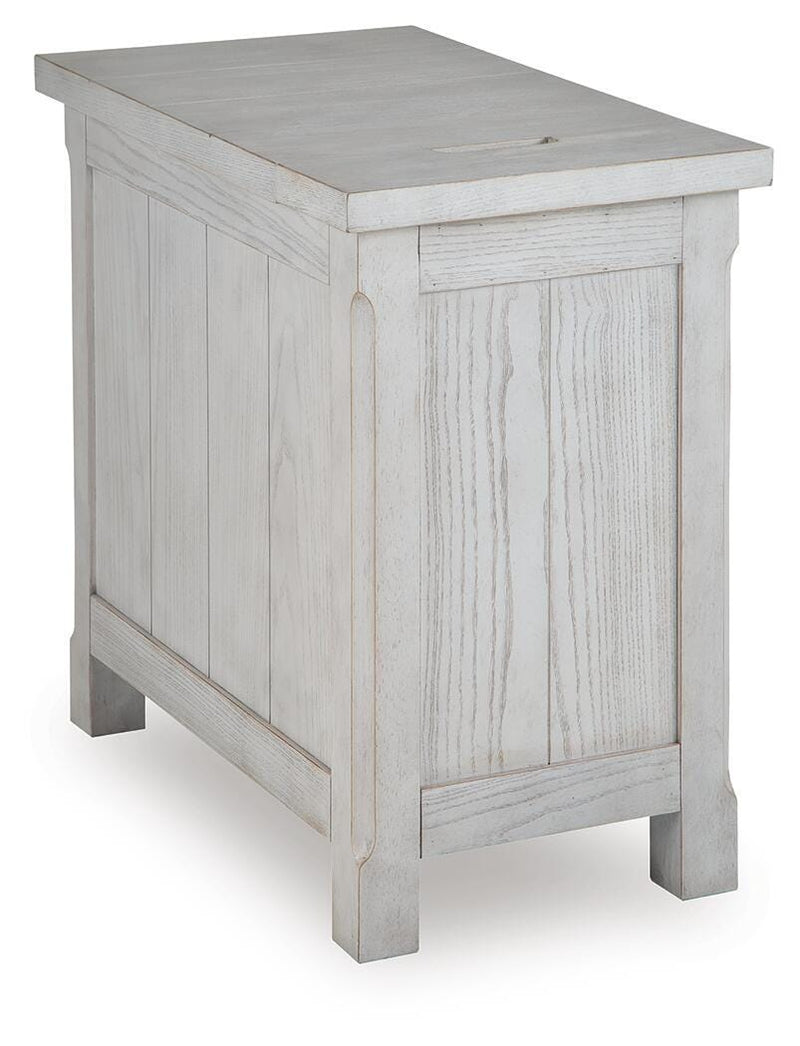 Ashley Furniture Robbinsdale chairside end table with a dark wood finish and a single drawer, shown from the back.