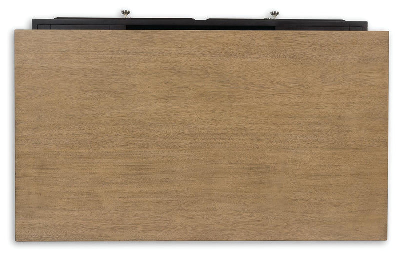 Ashley Furniture Drazmine lift-top cocktail table with a sleek wooden top and storage space, shown in a modern living room setting