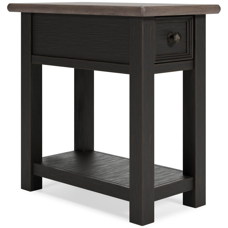 Ashley Furniture Tyler Creek occasional table set with two wood tables, one round and one rectangular, in a cozy living room setting.