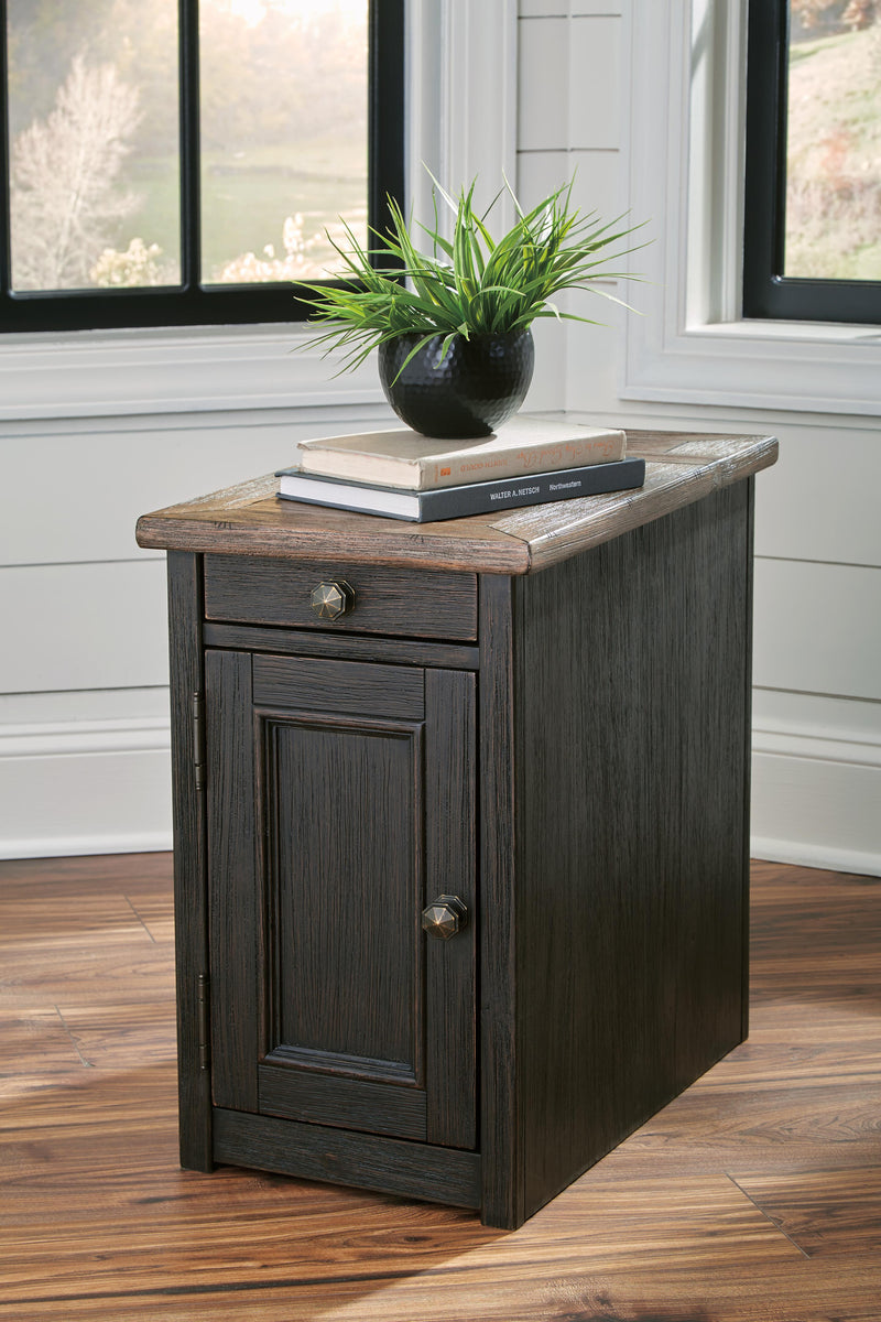 Ashley Furniture Tyler Creek Table Set featuring a wooden dining table and matching chairs in a modern design.