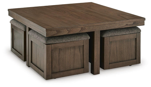 Ashley Furniture Boardernest coffee table with four stools, modern cocktail table set with wooden top and black metal legs.