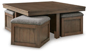 Ashley Furniture Boardernest Occasional Table Set featuring three stylish nesting tables with wooden tops and black metal frames.