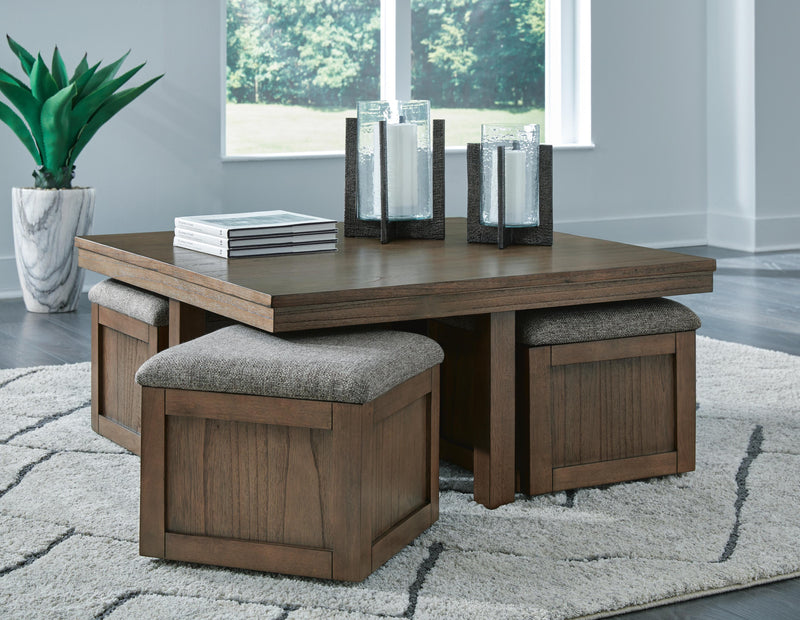 Ashley Furniture Boardernest Occasional Table Set with three nested wooden tables and sleek metal legs, ideal for living room decor.