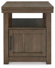 Ashley Furniture Boardernest Occasional Table Set with three wood tables featuring sleek, modern designs and smooth tabletops.
