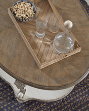 Ashley Furniture Realyn occasional table set featuring a modern design with two matching tables and sleek wooden finishes.