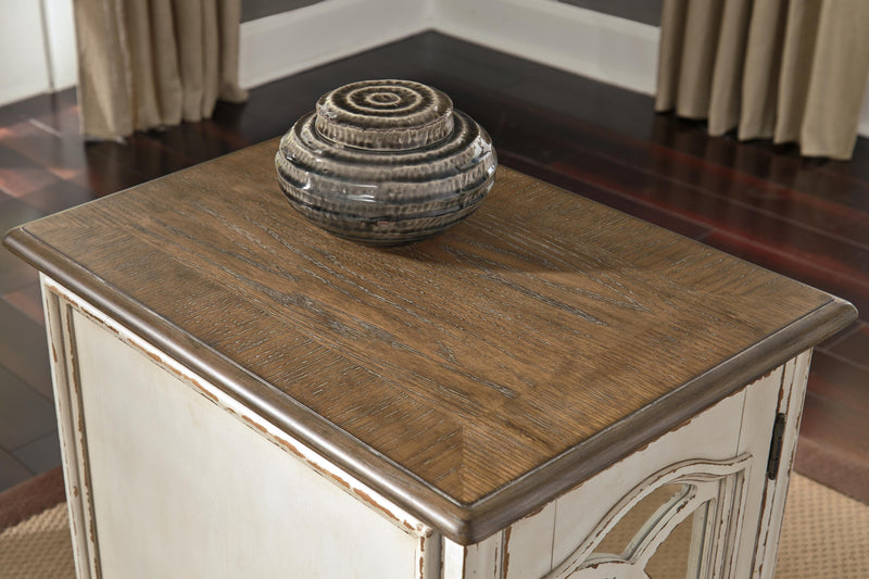 Ashley Furniture Realyn Occasional Table Set with three wooden tables featuring dark finish and modern design.