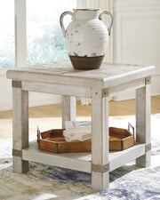 Ashley Furniture Carynhurst end table with a sleek wooden surface and modern design, perfect for living room decor.