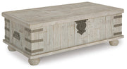 Ashley Furniture Carynhurst coffee table with lift top, modern cocktail table featuring a sleek wooden design and functional lift mechanism.