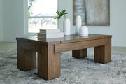 Ashley Furniture Rosswain Occasional Table Set with two round tables featuring wooden surfaces and metal legs.