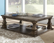 Ashley Furniture Johnelle coffee table with a sleek wooden surface and modern design, shown as a stylish cocktail table.