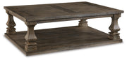 Ashley Furniture Johnelle Occasional Table Set featuring two elegant tables with dark wood finish and modern design.