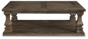 Ashley Furniture Johnelle cocktail coffee table with a sleek wooden top and sturdy metal legs, modern living room style.