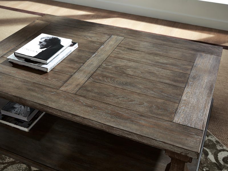 Ashley Furniture Johnelle Occasional Table Set with three wood tables featuring sleek tops and sturdy legs.