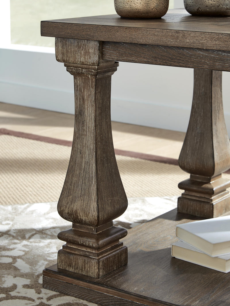 Ashley Furniture Johnelle Occasional Table Set with three stylish tables featuring wood finishes and modern design details.
