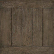 Ashley Furniture Johnelle coffee table with a sleek, modern cocktail design and a dark finish, showcasing a sturdy wooden build.