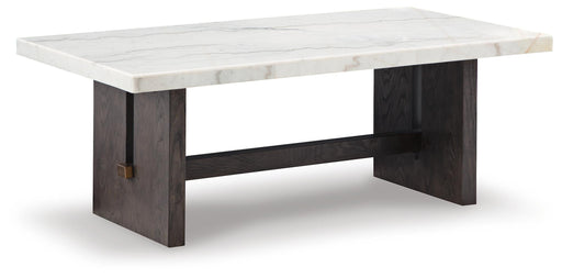 Ashley Furniture Burkhaus cocktail coffee table with a sleek wooden surface and modern design, shown at an angle.
