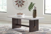 Ashley Furniture Burkhaus cocktail coffee table with a sleek wooden finish and modern design.