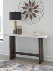 Ashley Furniture Burkhaus sofa table with a sleek wooden top and metal legs, perfect for living room decor.