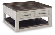 Ashley Furniture Darborn Lift-Top Coffee Table with angled closed lid and storage compartment, shown from a side angle.