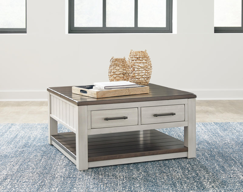 Ashley Furniture Darborn Lift-Top Coffee Table with a sleek lift-top design and storage space in a modern living room setting.