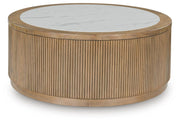 Ashley Furniture Camdill cocktail coffee table with a sleek wood finish and modern design, featuring a rectangular top and sturdy legs.