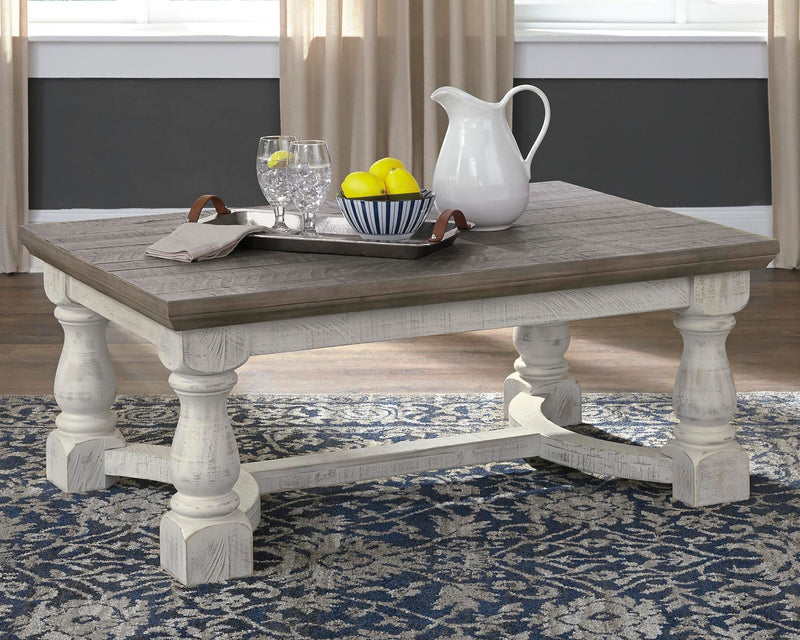 Ashley Furniture Havalance Occasional Table Set featuring two modern tables with wooden tops and sleek metal legs.