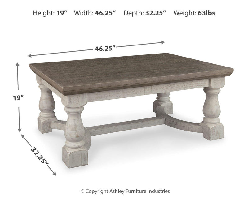 Ashley Furniture Havalance coffee table with a sleek wooden top and modern design, ideal for living room decor.