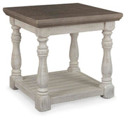 Ashley Furniture Havalance End Table featuring a sleek wood finish and modern design with a sturdy top and storage drawer.
