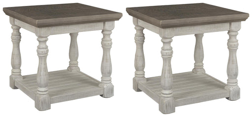 Ashley Furniture Havalance end table set showing two wooden tables with dark finish and modern design details.