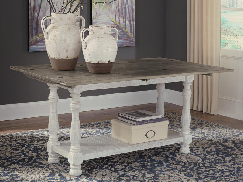 Ashley Furniture Havalance sofa table with open shelving and modern design, featuring a sleek wood finish and sturdy construction.