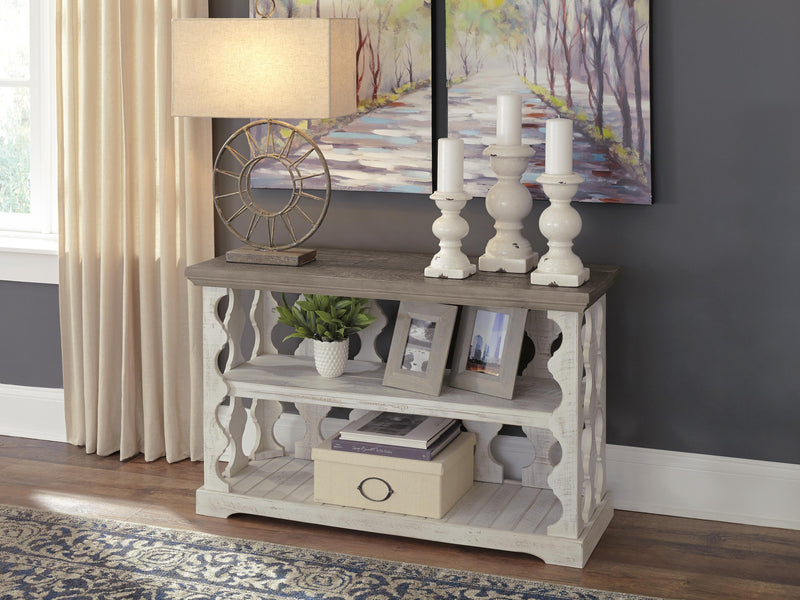 Ashley Furniture Havalance sofa console table with sleek wood finish and modern design, ideal for living room decor.