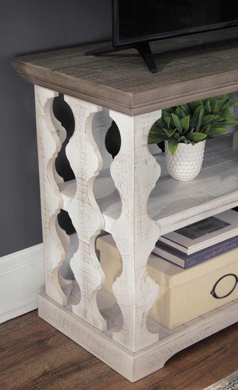 Ashley Furniture Havalance sofa table, console style with sleek wood finish and modern design, shown in detailed image.