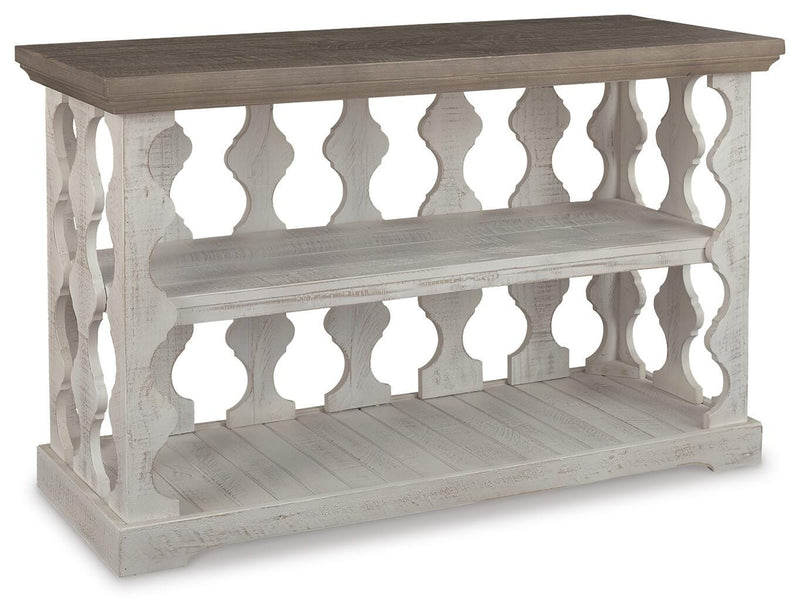 Ashley Furniture Havalance sofa console table with sleek design, featuring a dark wood finish and modern style.
