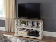 Ashley Furniture Havalance sofa table showing a sleek wooden console with a dark finish and modern design.
