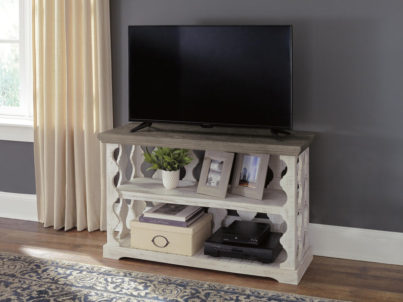 Ashley Furniture Havalance sofa table showing a sleek wooden console with a dark finish and modern design.