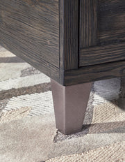 Ashley Furniture Todoe Occasional Table Set with two modern wooden tables featuring sleek designs and natural wood finishes.