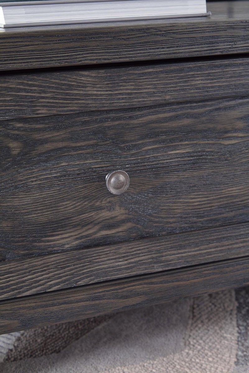 Ashley Furniture Todoe Occasional Table Set, close-up view of the modern, wooden side tables with sleek design and metal accents.