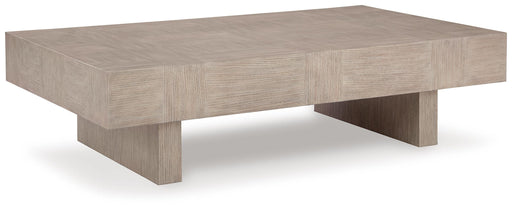 Ashley Furniture Jorlaina coffee cocktail table with a sleek wooden finish, shown from an angled perspective.