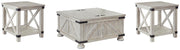 Ashley Furniture Carynhurst occasional table set with three wooden tables featuring a dark finish and sleek design.