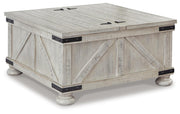 Ashley Furniture Carynhurst coffee table with a sleek wooden finish, shown from an angled view highlighting its modern design.