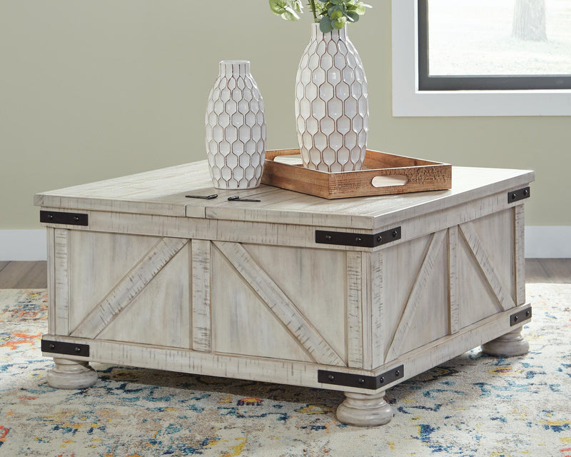 Ashley Furniture Carynhurst cocktail coffee table with a dark wood finish and elegant design, shown from a top-down view.