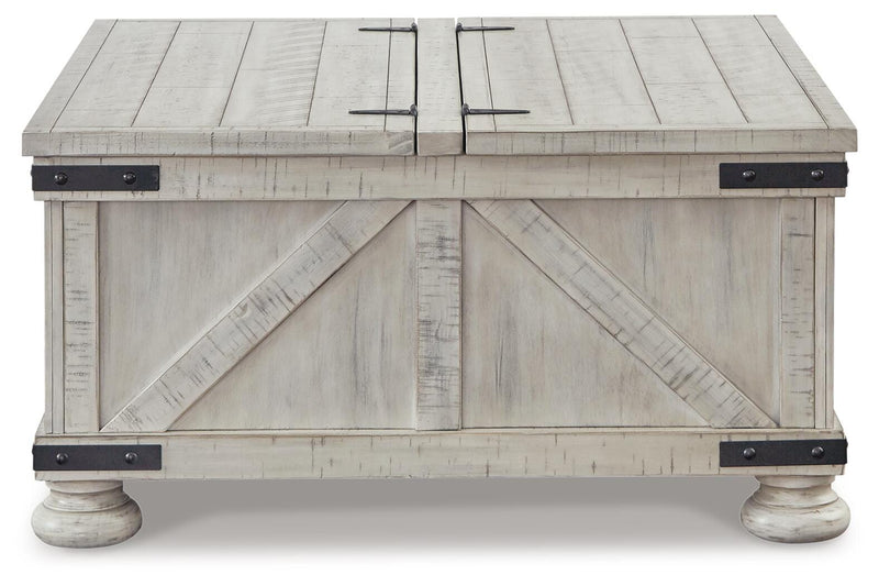 Ashley Furniture Carynhurst coffee table with a sleek wooden top and sturdy legs, perfect for modern living room decor.