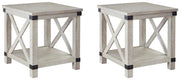 Ashley Furniture Carynhurst occasional table set with three wooden tables featuring modern design and warm wood finishes.