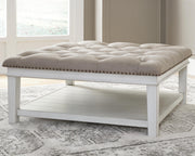 Ashley Furniture Kanwyn upholstered cocktail ottoman coffee table with cushioned top and wooden legs, modern and versatile design