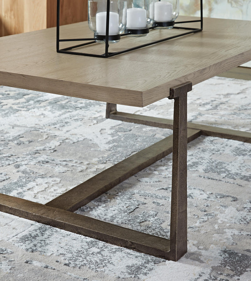 Ashley Furniture Dalenville cocktail coffee table with a wooden finish and modern design, featuring a smooth surface and sturdy legs.